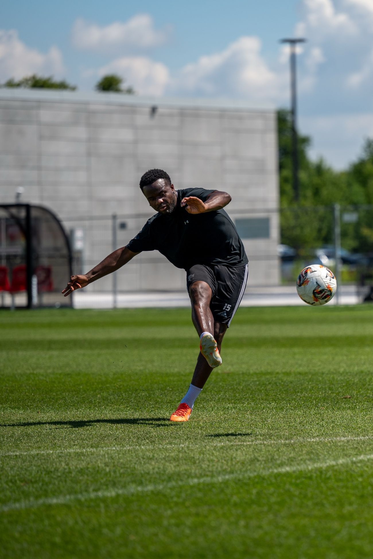 H2 Soccer player striking the ball