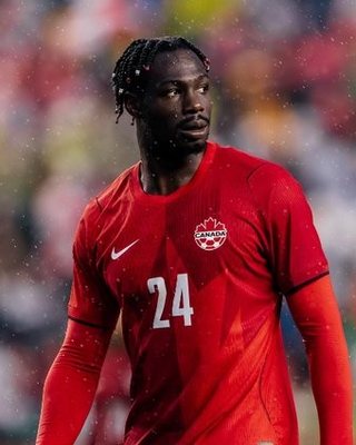 Promise David in a Canada national team kit